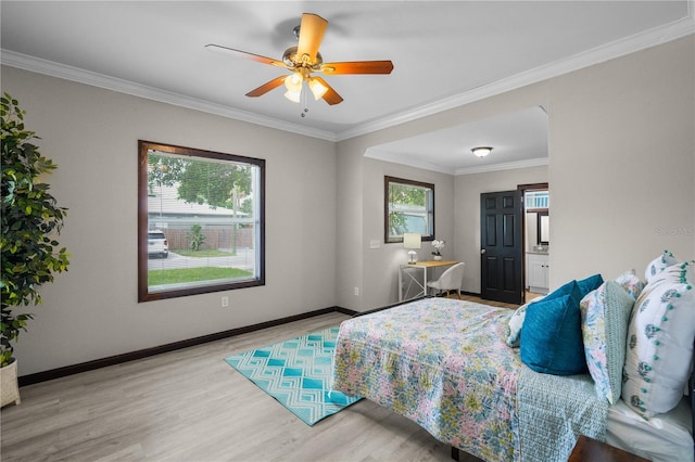 bedroom featuring ceiling fan, crown molding, and light hardwood / wood-style floors