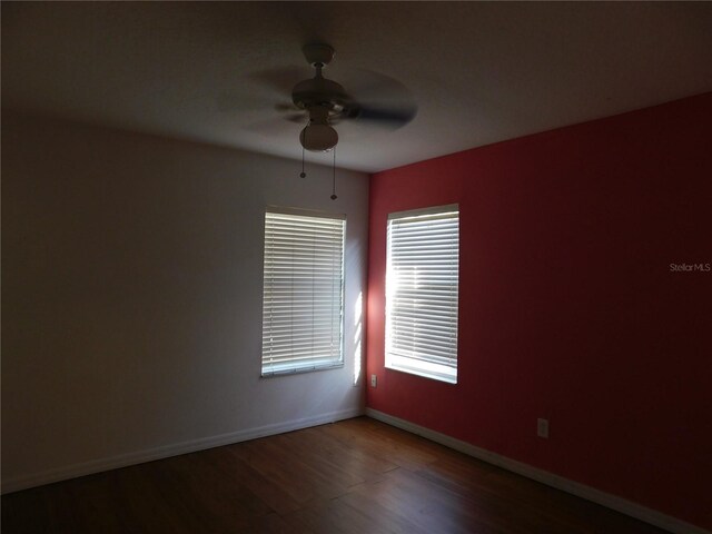 spare room featuring ceiling fan and wood-type flooring