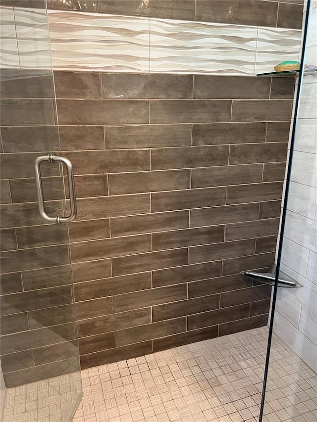 bathroom with a shower with shower door