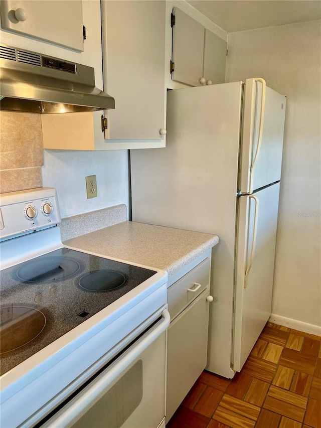 kitchen with white electric range oven, white cabinetry, and light parquet floors