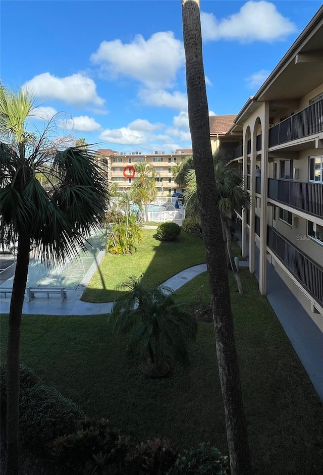 view of community featuring a yard