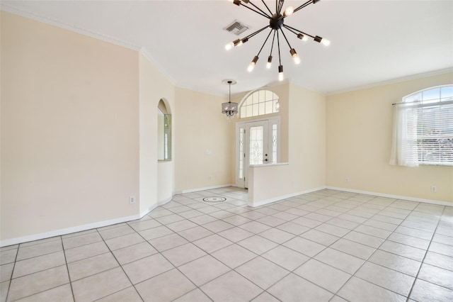 tiled empty room with ornamental molding and a notable chandelier