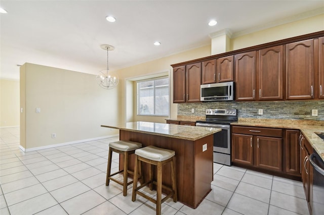 kitchen featuring a center island, hanging light fixtures, stainless steel appliances, a notable chandelier, and light tile patterned flooring