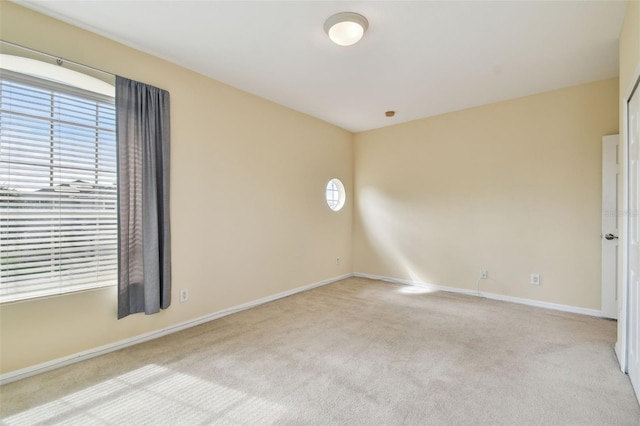 carpeted empty room featuring a healthy amount of sunlight