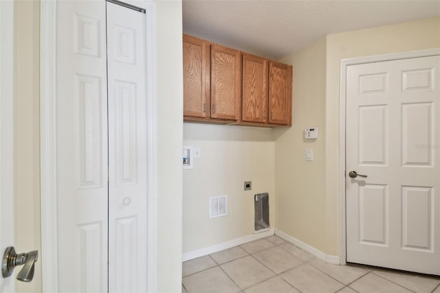 washroom with cabinets, hookup for a washing machine, light tile patterned floors, and electric dryer hookup