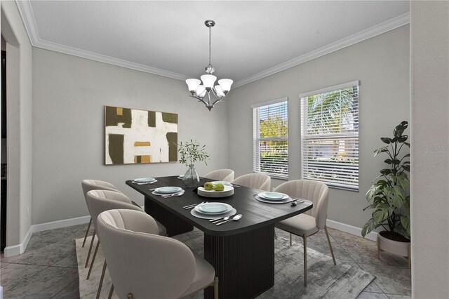 tiled dining room featuring ornamental molding and a chandelier