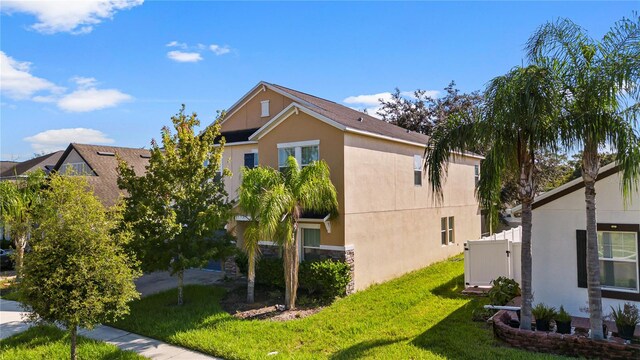 view of property exterior featuring a yard