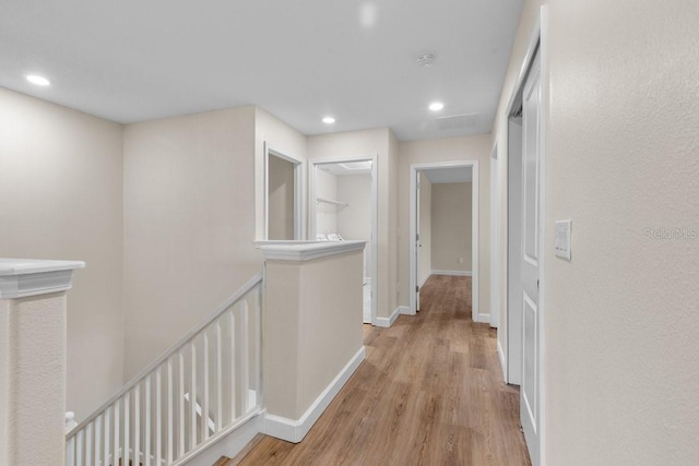 hall with light hardwood / wood-style flooring