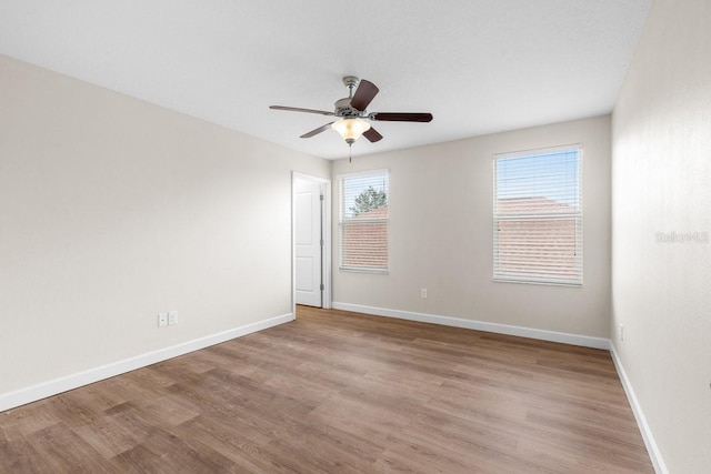 unfurnished room with ceiling fan and light hardwood / wood-style floors