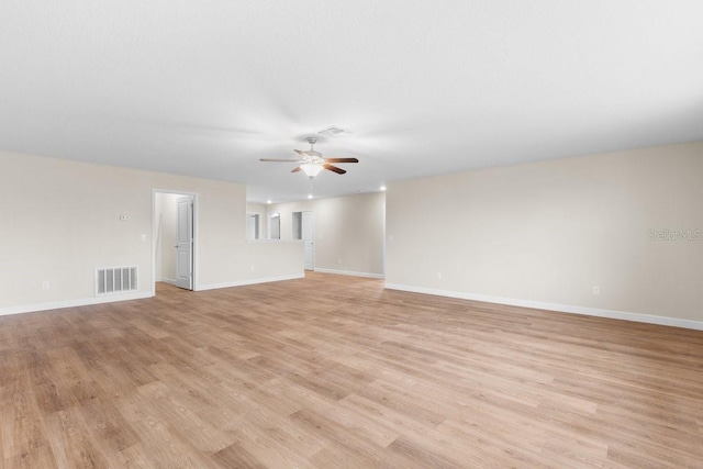 empty room featuring light hardwood / wood-style floors and ceiling fan