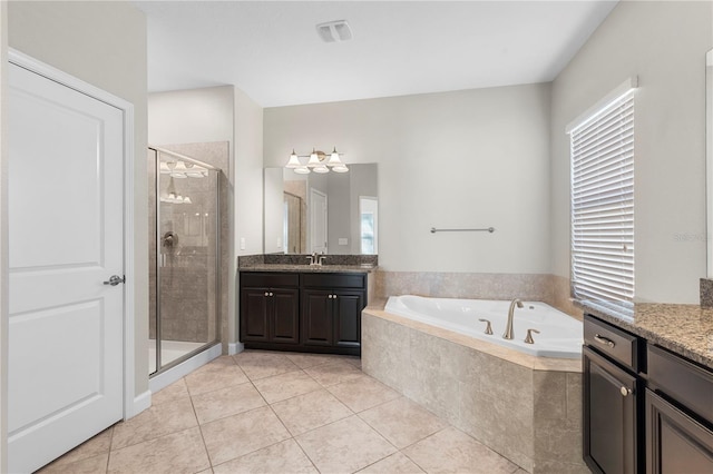 bathroom with tile patterned floors, separate shower and tub, and vanity