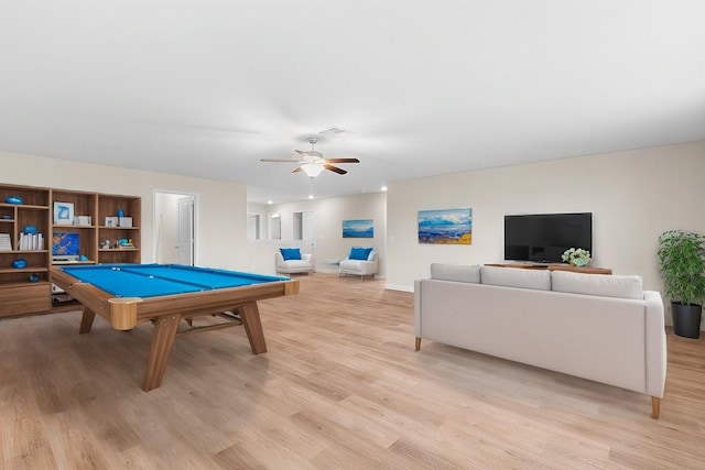 rec room featuring light wood-type flooring, ceiling fan, and pool table