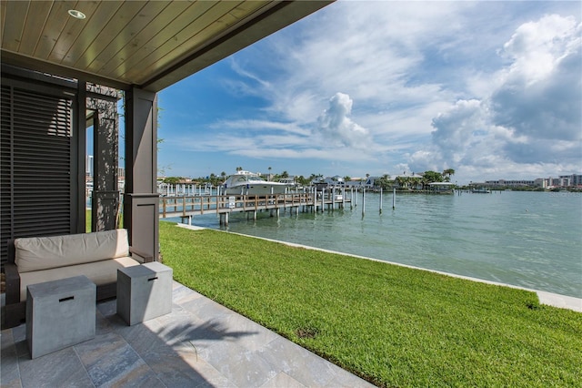 exterior space featuring a boat dock and a water view