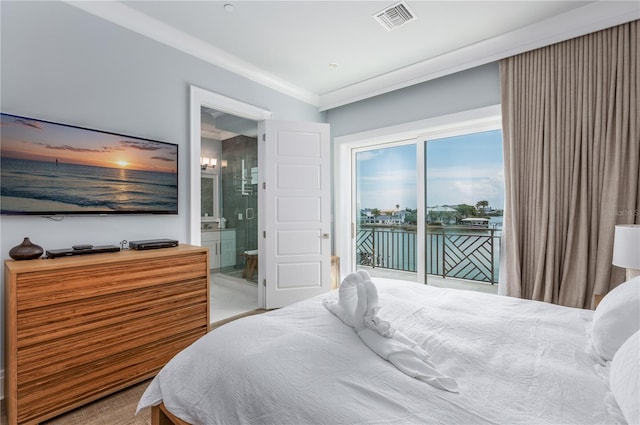 bedroom featuring ornamental molding, a water view, ensuite bathroom, and access to outside