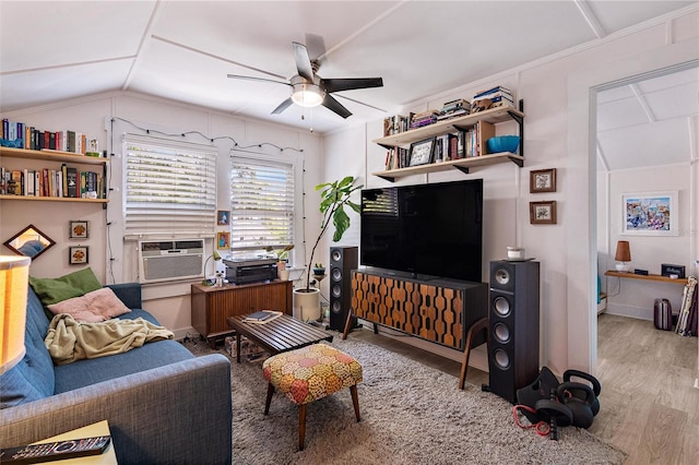 living room featuring cooling unit, lofted ceiling, ceiling fan, and hardwood / wood-style floors