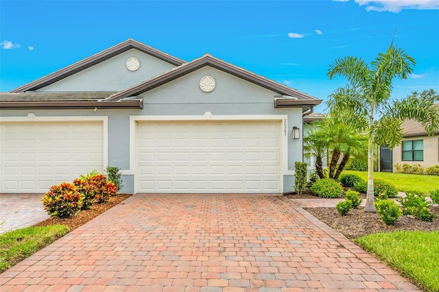 ranch-style home featuring a garage