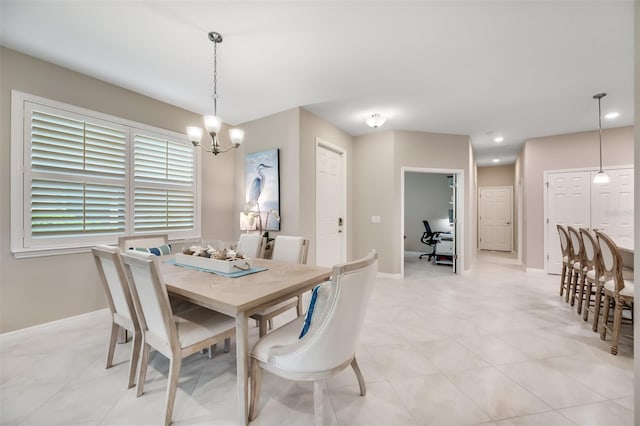 dining room featuring a chandelier