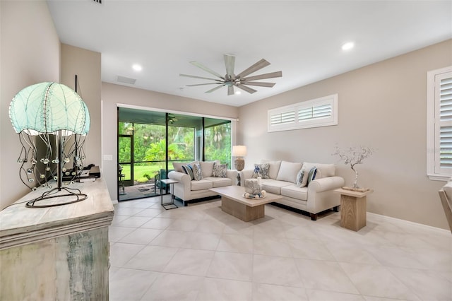 living room featuring ceiling fan and light tile patterned flooring