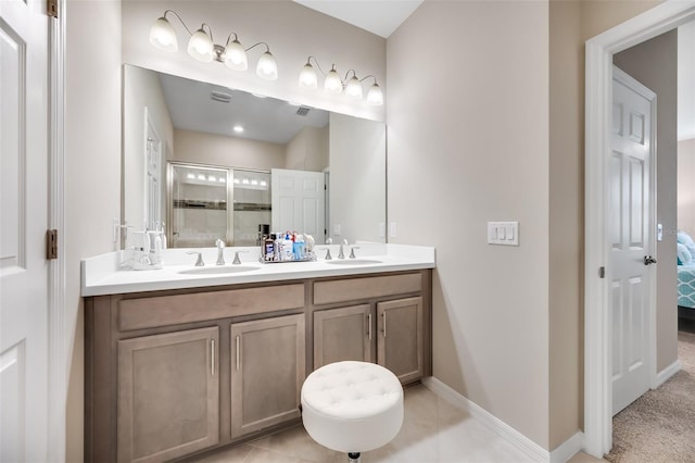 bathroom featuring vanity, tile patterned flooring, and an enclosed shower