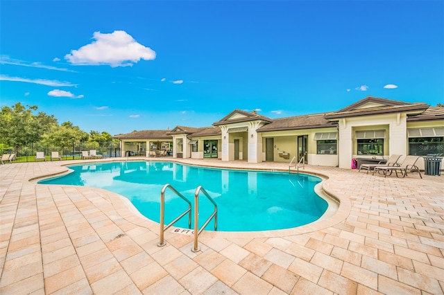 view of pool featuring a patio