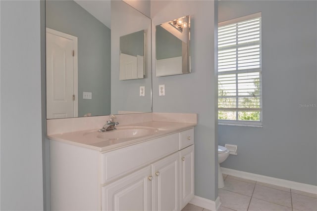 bathroom featuring tile patterned floors, vanity, toilet, and lofted ceiling