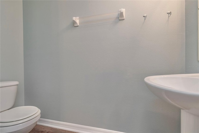 bathroom featuring sink and toilet