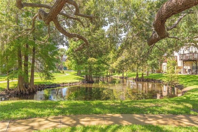 surrounding community featuring a water view