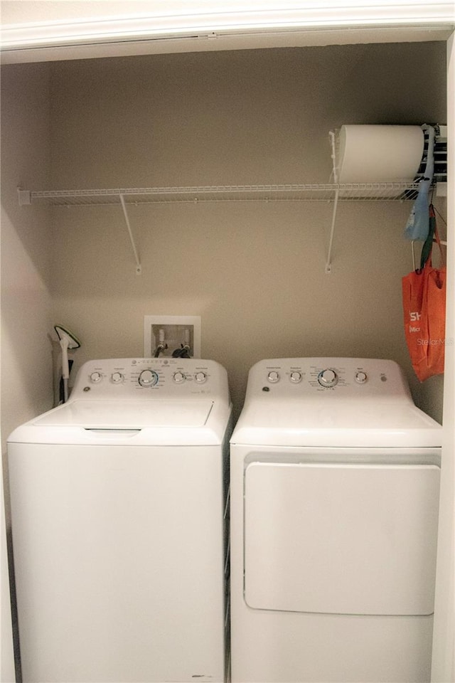 laundry room with washing machine and clothes dryer