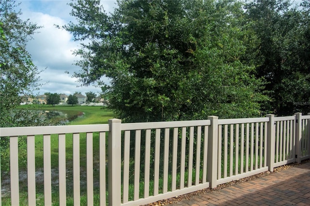 exterior space featuring a yard and a water view