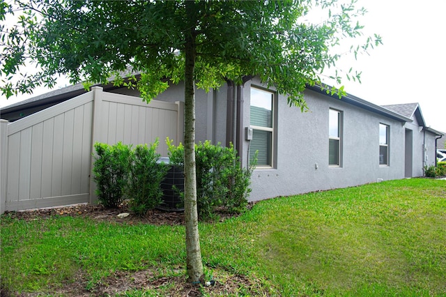 view of side of property featuring a yard