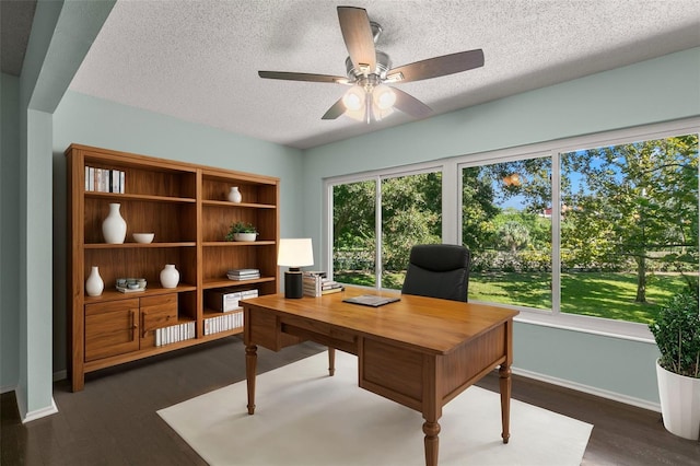 office space with ceiling fan, dark hardwood / wood-style flooring, and a textured ceiling