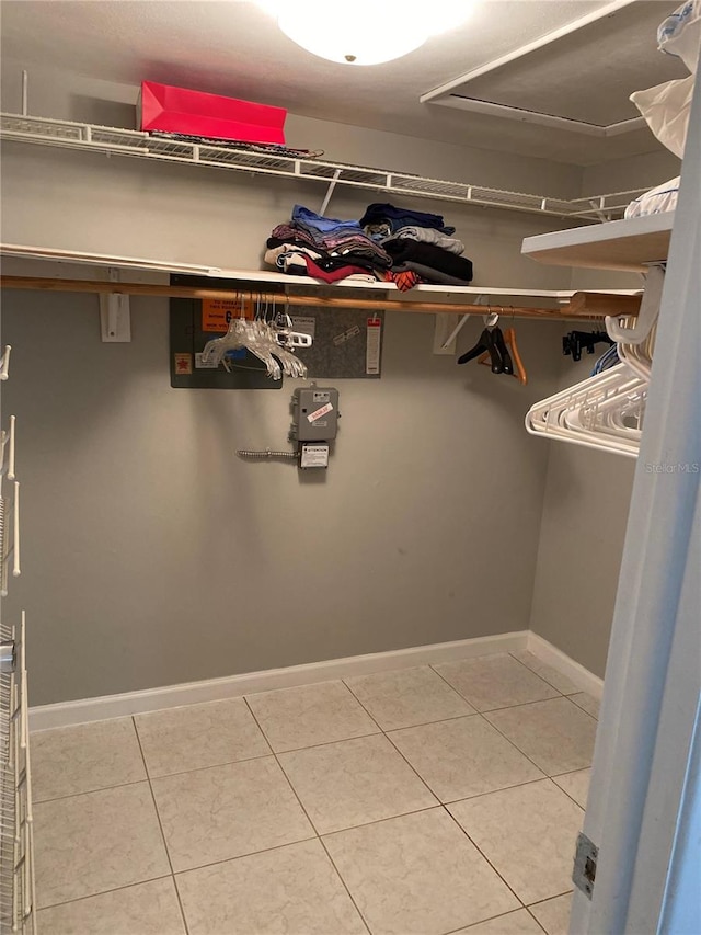 spacious closet with tile patterned floors