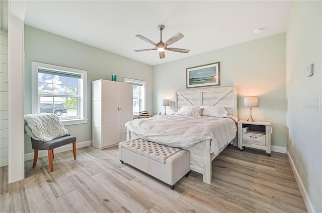 bedroom featuring light wood-type flooring and ceiling fan