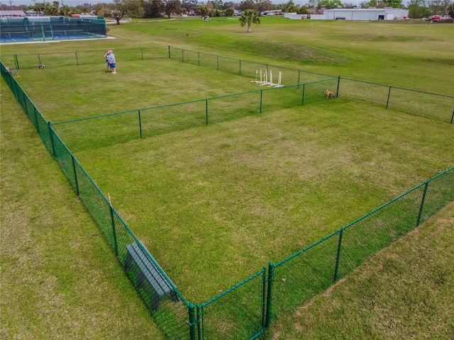 view of property's community with a lawn