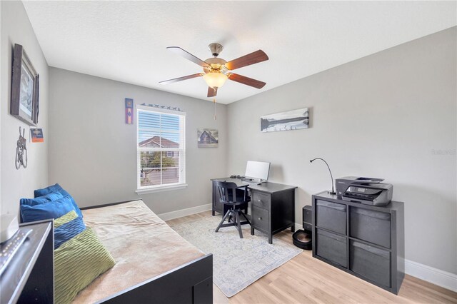 bedroom with light wood-type flooring and ceiling fan