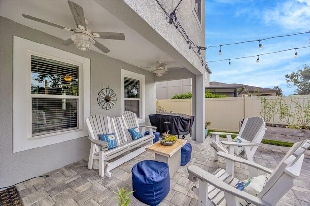 view of patio / terrace featuring ceiling fan and grilling area