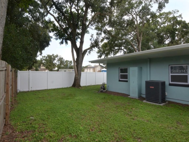 view of yard featuring central AC unit