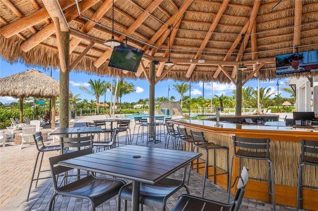 view of patio / terrace featuring a gazebo and exterior bar