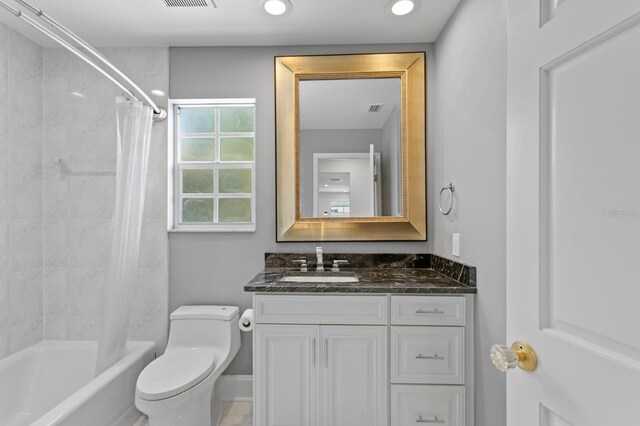 45 Adalia Ave, Tampa, FL 33606 - bathroom featuring vanity, toilet, shower / bathtub combination with curtain, and recessed lighting