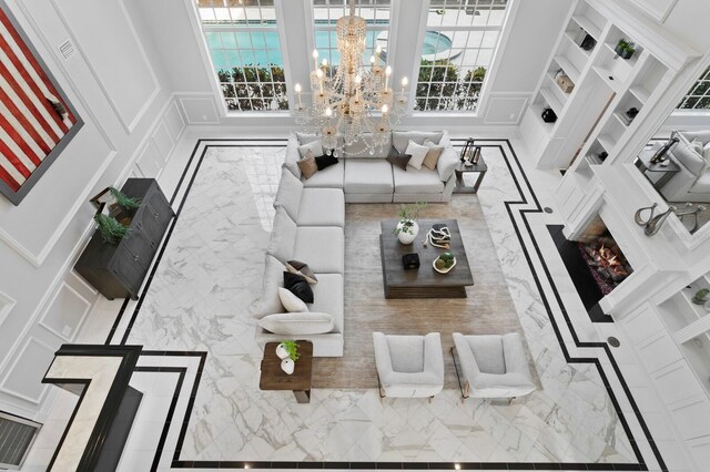45 Adalia Ave, Tampa, FL 33606 - living room featuring a decorative wall, a chandelier, and plenty of natural light