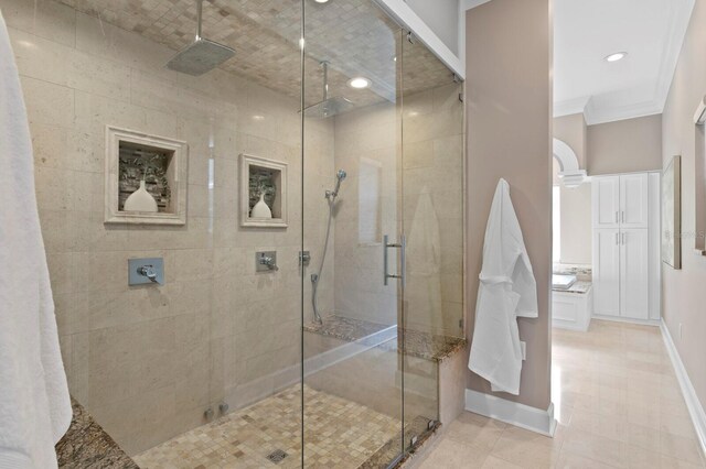 45 Adalia Ave, Tampa, FL 33606 - full bathroom featuring a stall shower, baseboards, tile patterned flooring, and ornamental molding