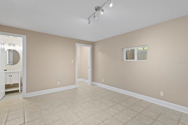 45 Adalia Ave, Tampa, FL 33606 - unfurnished room featuring rail lighting and baseboards