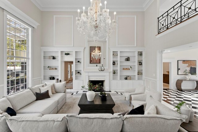 45 Adalia Ave, Tampa, FL 33606 - living area with a chandelier, ornamental molding, built in features, a decorative wall, and a premium fireplace