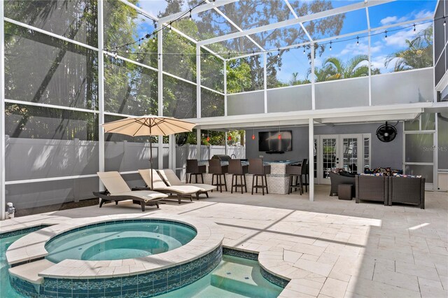 45 Adalia Ave, Tampa, FL 33606 - view of pool featuring french doors, a patio, a lanai, and a pool with connected hot tub