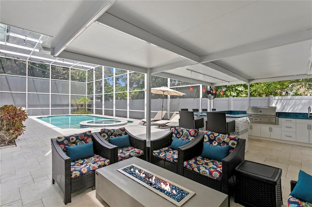 45 Adalia Ave, Tampa, FL 33606 - view of patio with area for grilling, a fenced backyard, exterior kitchen, an outdoor living space with a fire pit, and a lanai