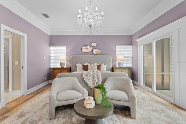 45 Adalia Ave, Tampa, FL 33606 - bedroom featuring light wood-type flooring, a chandelier, ornamental molding, and baseboards