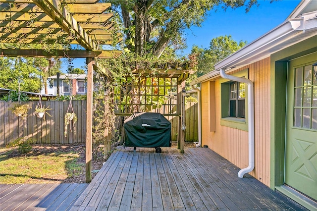 deck with a pergola and grilling area