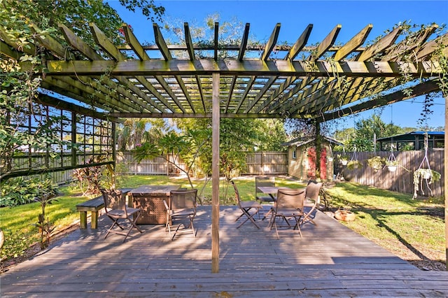 wooden deck with a pergola, a shed, and a lawn