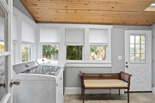 laundry area with washing machine and dryer and wood ceiling