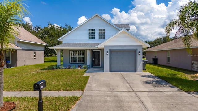 view of front of house featuring a garage and a front yard